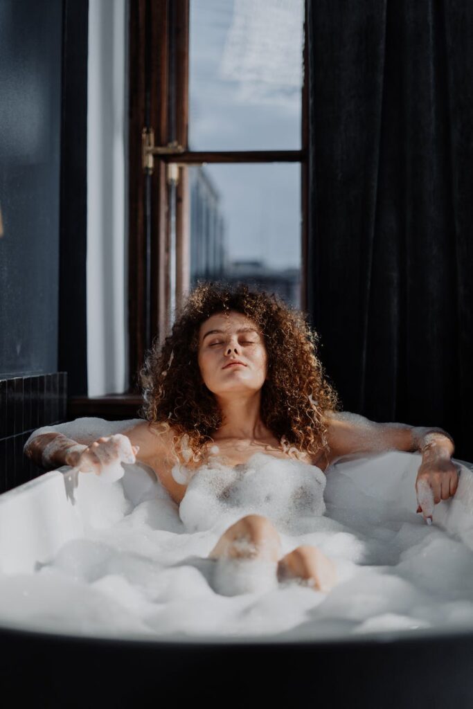 woman in bathtub with water